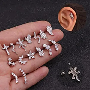 Selection of zircon-inlaid titanium steel cartilage studs in various unique animal and geometric shapes