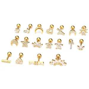 Collection of CZ paved stainless steel cartilage stud earrings in various gold shapes.
