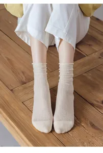 Breathable mesh mid-calf socks for women, thin rolled-edge summer stacking socks detail view.