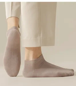 Detail view of men's low-cut solid color cotton socks showing fine knit texture and ankle fit.