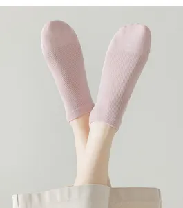 Close-up detail of women's breathable pink mesh short socks, comfortable and soft fabric.