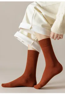 Thickened winter crew socks in solid caramel brown, soft loop knit for cozy daily wear detail.
