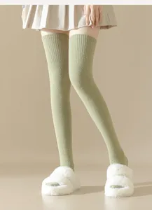 Cozy over-the-knee thermal green velvet winter socks designed for warm and stylish daily wear.