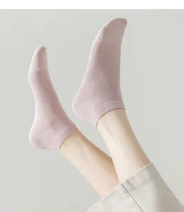 Detail close-up view of breathable mesh short socks in light pink, showing fine knit texture.