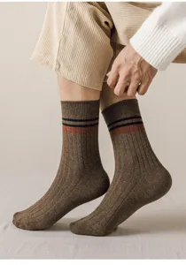 Men's combed cotton mid-tube socks detail, featuring cozy ribbed knit and classic striped cuffs.