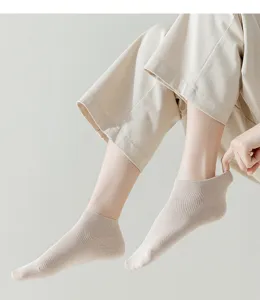 Detail view of women's breathable mesh short socks in beige, featuring low-cut design for sneakers.