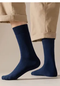 Detailed shot of men's thick navy blue crew socks, solid color winter loop pile comfort.