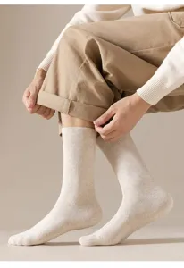 Detail shot of men's solid color winter terry crew socks, soft knit texture and comfortable fit.