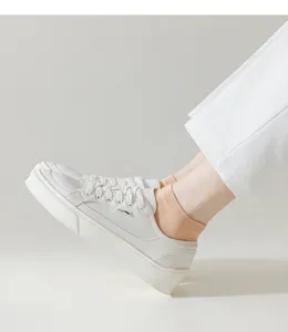 Comfortable breathable cotton short socks for women paired with versatile casual white canvas shoes.