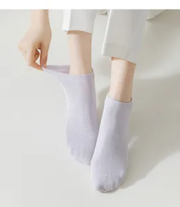 Detail shot of light purple cotton short socks, breathable, elastic cuff, soft everyday wear.