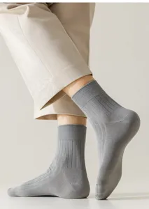 Detail view of men's grey ribbed cotton mid-calf socks showcasing soft texture and knit.