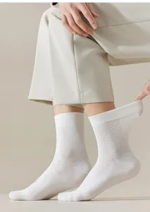 Close-up detail shot of white mesh breathable mid-calf men's socks showing soft cotton texture.