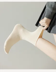 Comfortable cream ribbed mid-tube women socks, soft cotton elastic daily hosiery wear.
