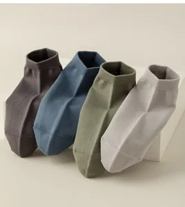 Detailed view of men's solid cotton short socks in four neutral colors for daily wear.