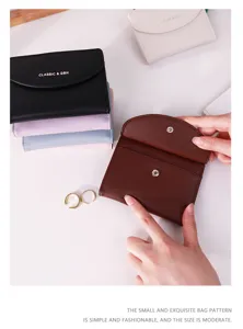 Close-up of minimalist solid color mini wallets showing interior and multiple color options