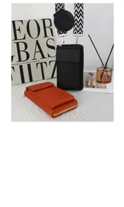 Detailed view of black and orange crossbody phone bags with wide geometric patterned strap