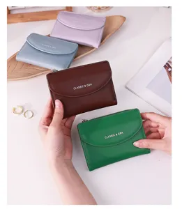 Detail view of minimalist colorful faux leather wallets for women in four different shades