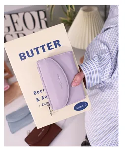 Minimalist lavender purple faux leather wallet featuring a flap closure and secure zip pocket