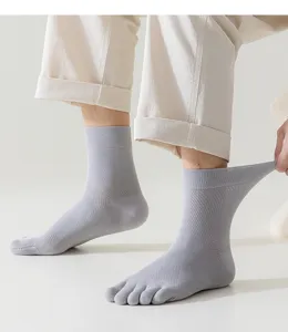 Close-up of breathable five-toe socks with mesh design, offering comfortable split-toe wear.