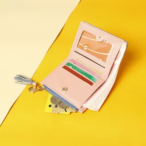 Detailed view of pink women's short wallet interior with card slots and coin pocket.