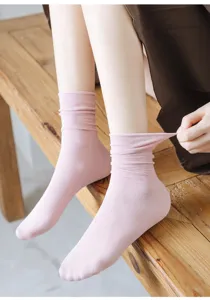 Close-up detail of women pink ribbed stack socks showing soft cotton texture and elastic edge.