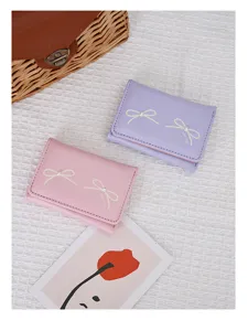 Cute Korean style bow-knot women's tri-fold short wallet in pink and purple colors