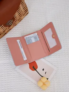 Small pink tri-fold wallet for women with multiple card slots and clear window