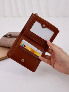Brown short PU leather wallet for women with multiple card slots and clear ID window