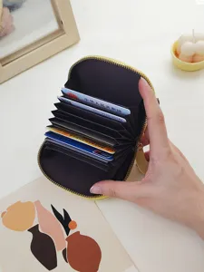 Dainty yellow accordion card holder wallet featuring multiple slots and secure zipper