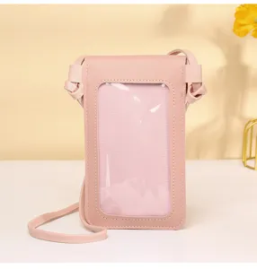 Close-up view of pink crossbody phone bag featuring transparent touchscreen window