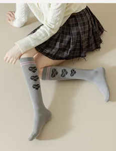 Grey knee high socks with cute black heart patterns and pink stripes, soft cotton JK style.