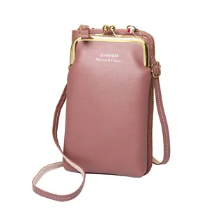 Elegant mauve vertical crossbody phone bag featuring gold kiss-lock clasp and zipper pocket