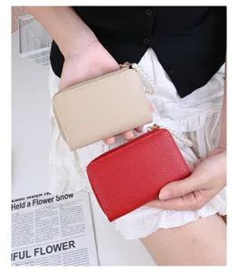 Litchi pattern leather mini wallets with pearl wristlet straps in beige and red colors