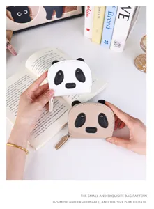 Close-up of cute cartoon panda zippered mini wallets in white and beige colors