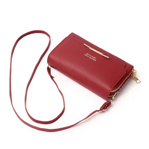 Close-up view of a dark red double-zipper multi-functional crossbody phone bag for women