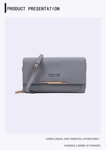 Front view of grey double-layer crossbody phone bag with gold-tone hardware detail