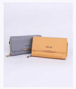 Two stylish double-layer phone bags in grey and yellow with metal bar detail