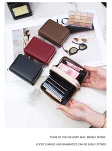 Close-up of pink accordion card holder with multiple slots and double zippers