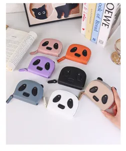 Detailed macro view of cute panda cartoon zip card holders and coin purses in multiple colors