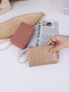 Stylish women's short faux leather wallet with crocodile pattern and pearl chain strap