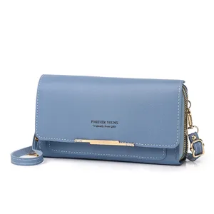 Close-up of a blue double-layer multi-functional crossbody phone bag with gold accents