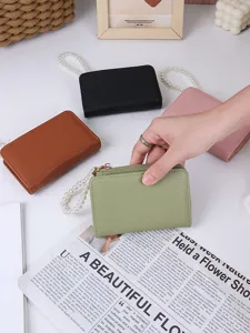 Compact litchi grain wallets with pearl wrist strap in black, pink, brown, and green