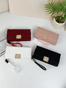 Elegant ladies long wallets set in four colors with decorative gold clasps and wristlet straps