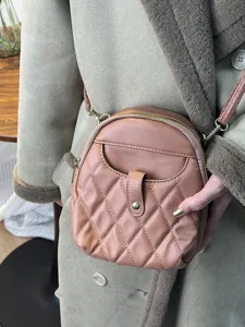 Elegant quilted faux leather mini backpack and crossbody bag for women in dusty pink