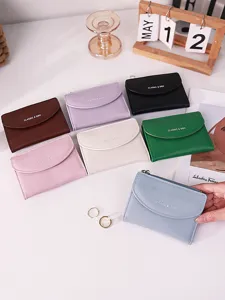 Minimalist multi-color PU leather card holders and wallets for women displayed on a desk