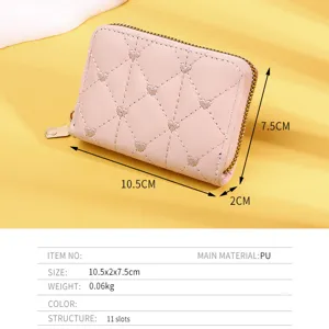 Detailed view of pink heart-quilted wallet with dimension specs and 11-card slots