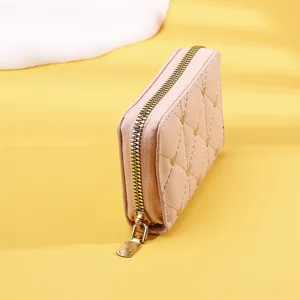 Close-up detail showing the gold zipper and quilted texture of this pink card holder wallet