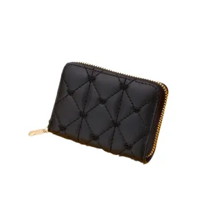 Elegant compact quilted black leather card holder with heart stitching and gold zipper