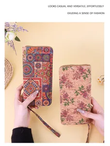 Two bohemian long wallets with floral and mandala prints held against a yellow background