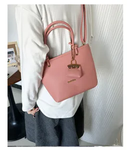 Premium pink litchi grain leather tote bag with a decorative small pouch on shoulder